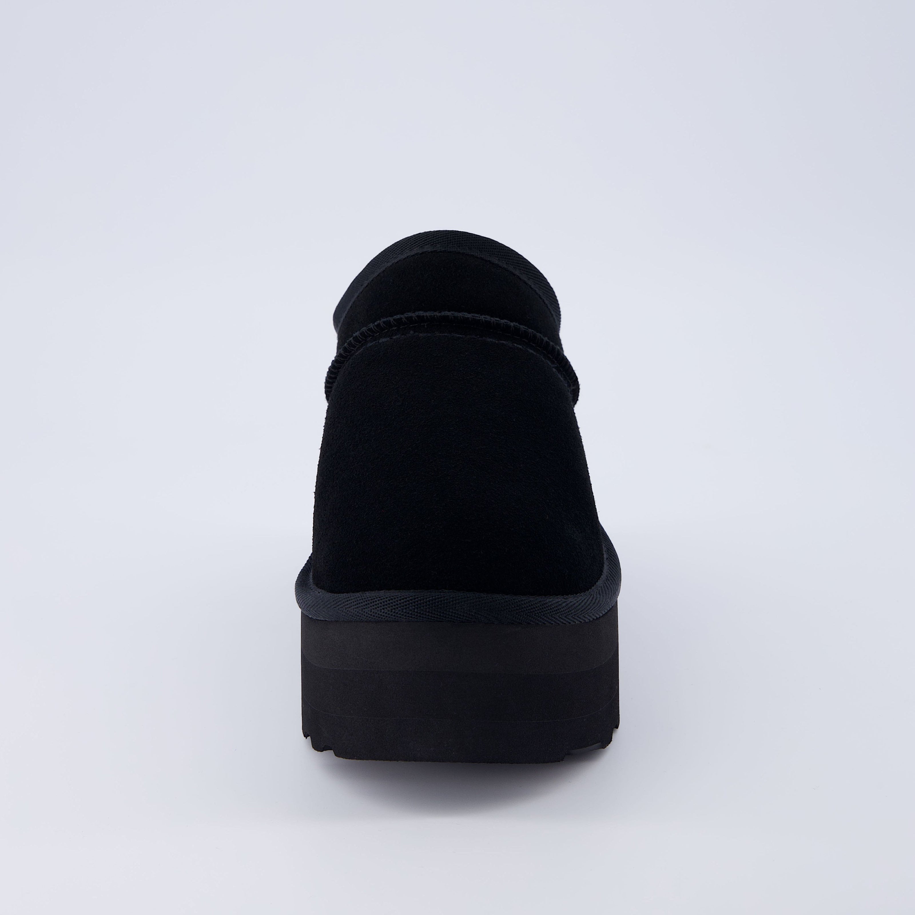 Huggy Shearling Platform Clogs