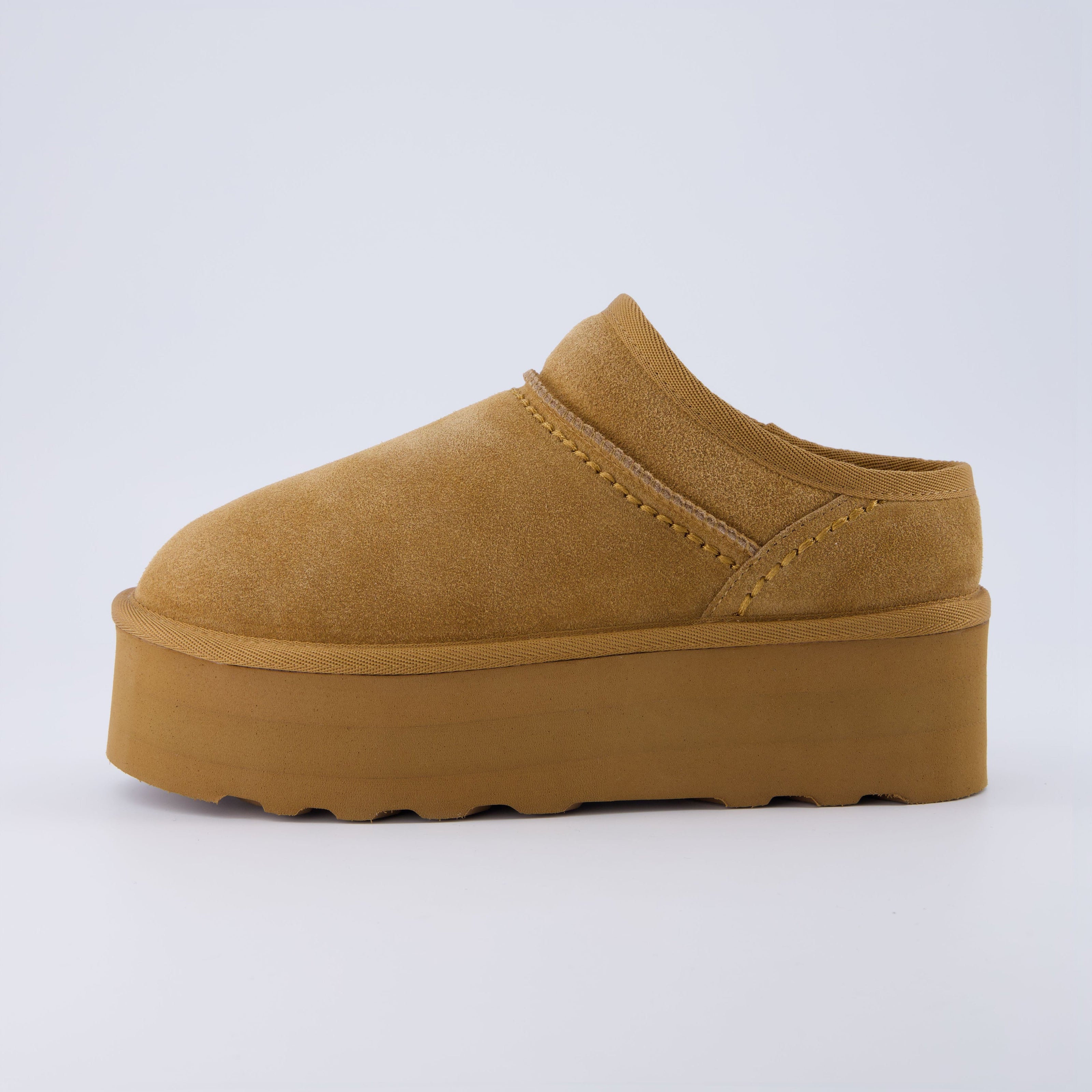 Huggy Shearling Platform Clogs