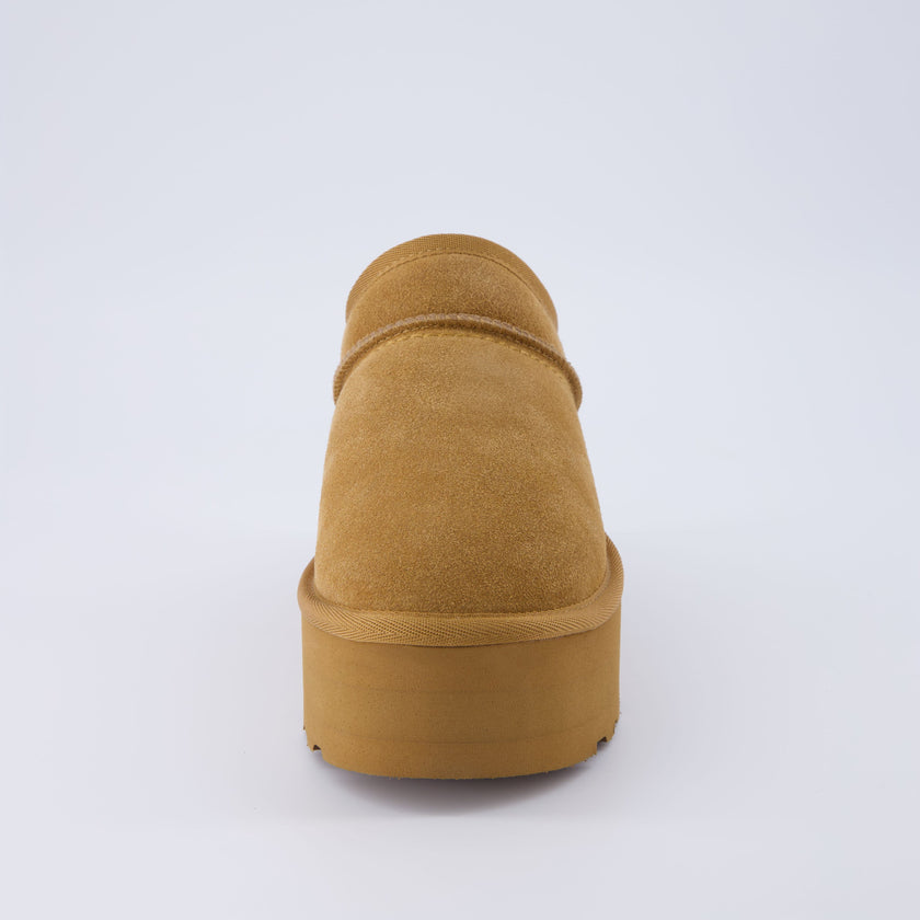 Huggy Shearling Platform Clogs