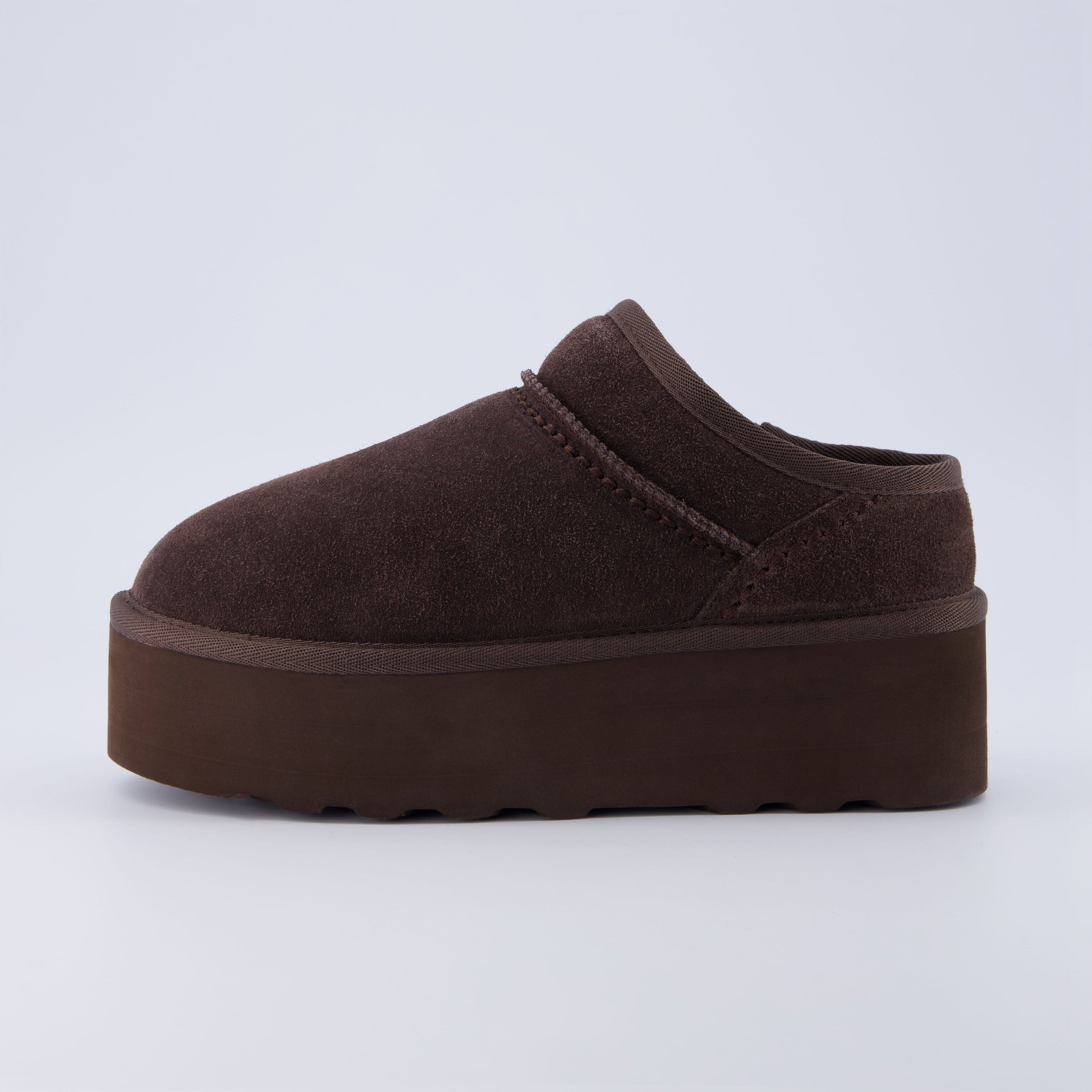 Huggy Shearling Platform Clogs