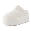 Huggy Shearling Platform Clogs