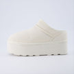 Huggy Shearling Platform Clogs