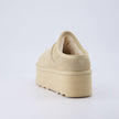 Huggy Shearling Platform Clogs