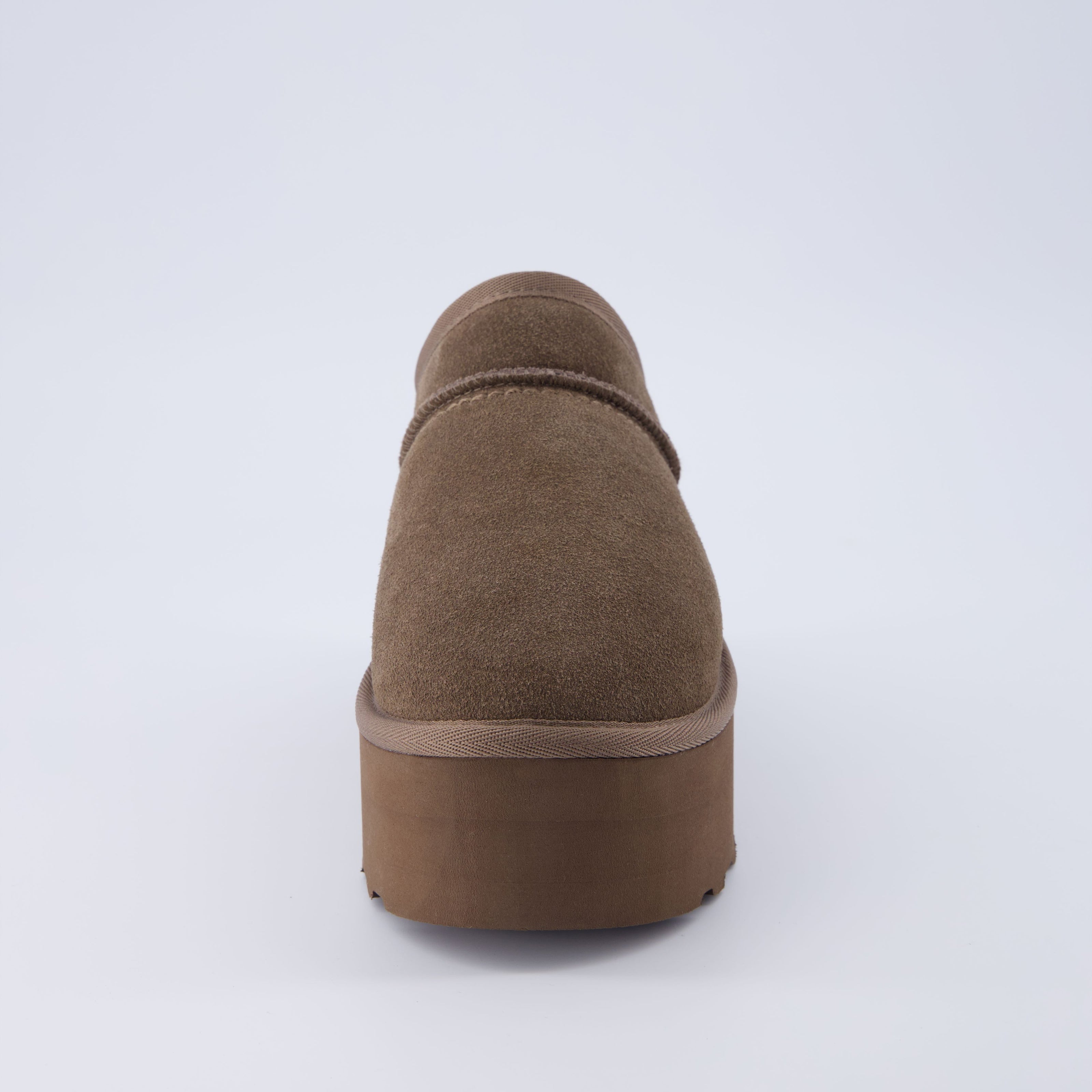 Huggy Shearling Platform Clogs