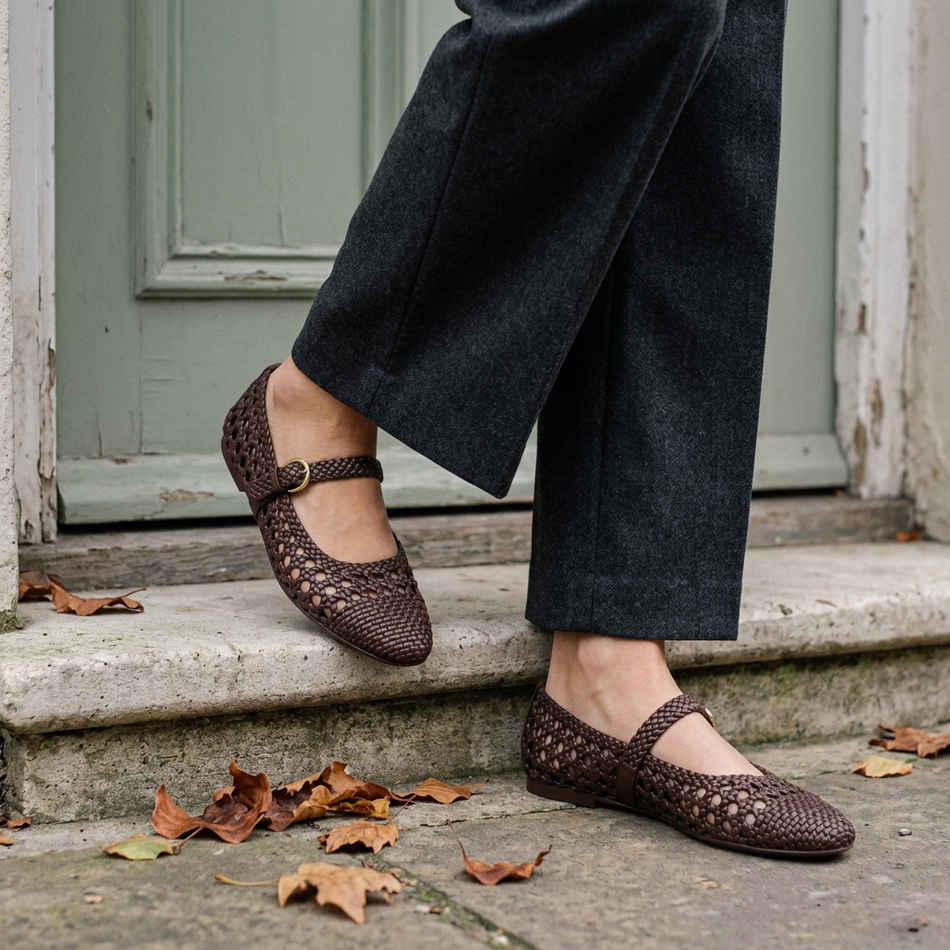 v2 Brown woven Mary Jane flats on a stone doorstep with autumn leaves