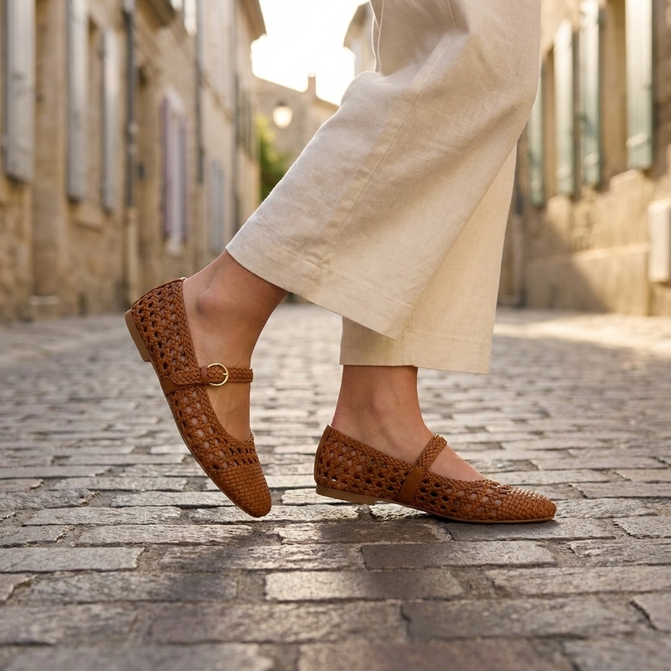 v2 Cognac woven Mary Jane flats walking on a cobblestone street