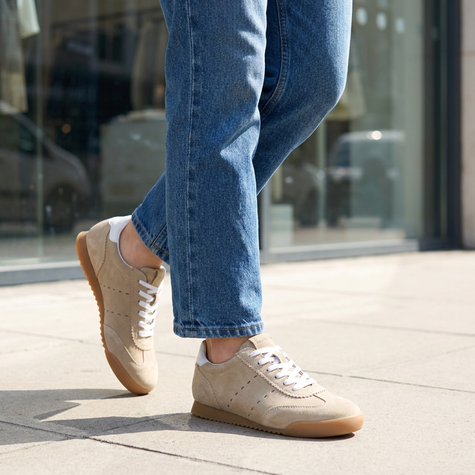 v2 Biscuit Tock suede sneakers walking a city sidewalk