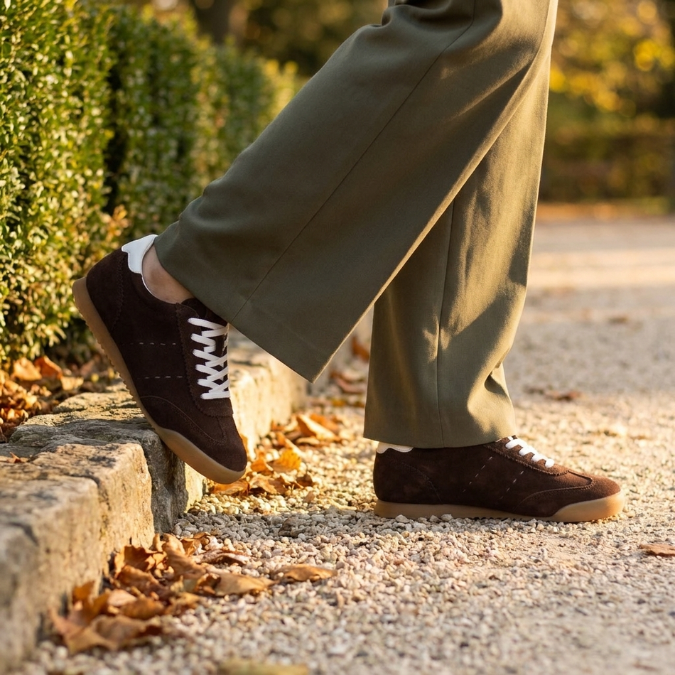 v2 Brown Tock suede sneakers on a gravel park path