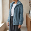 v2 Blue Isadora fluffy cardigan worn in a cafe
