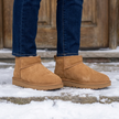 Hip Cozy faux fur lined ankle boots on a snowy doorstep