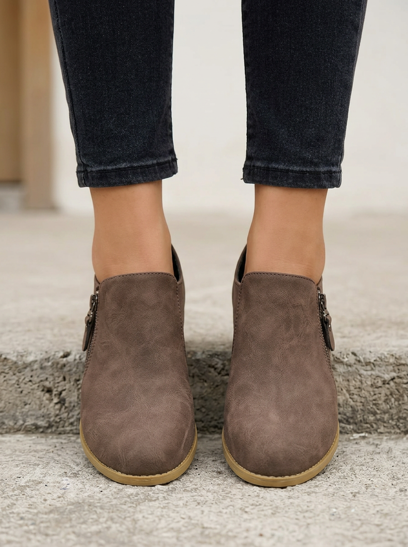 Cushioned footbed and anti slip tread on brown suede ankle boots