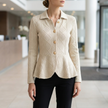 Argyle cable knit button down cardigan worn with tailored trousers