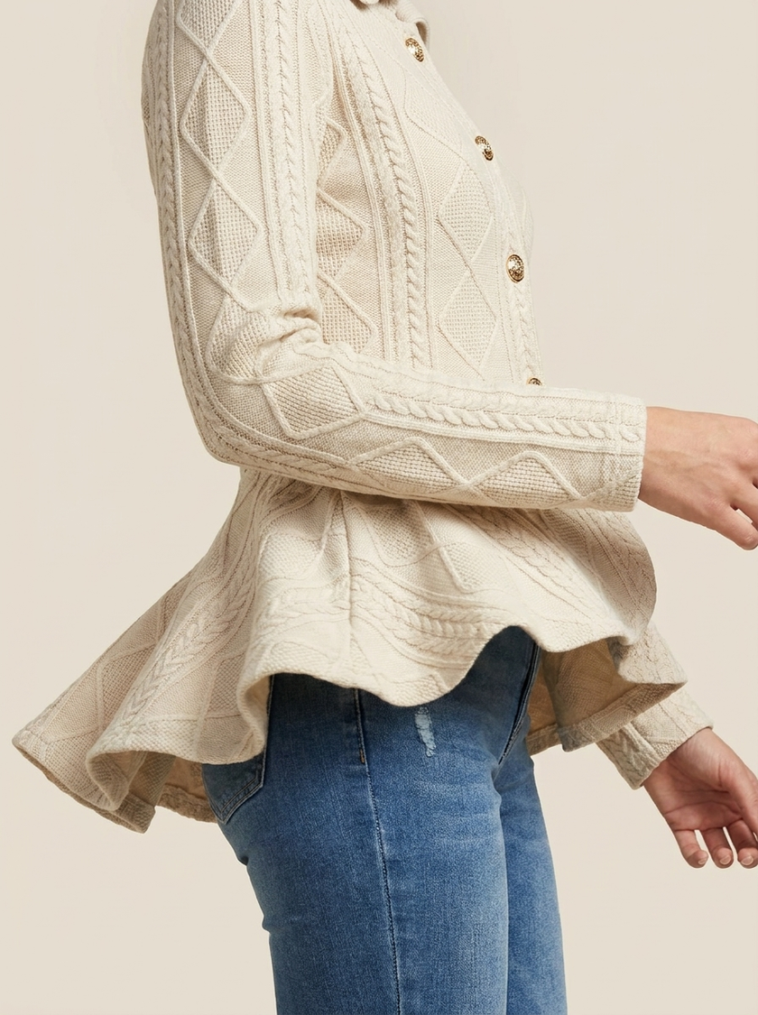 Ruffled peplum hem of the argyle cardigan jacket in motion