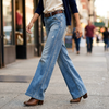 High waist wide leg flare jeans in faded light wash, front view