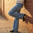 Wide leg flare jeans styled on model, alternate view