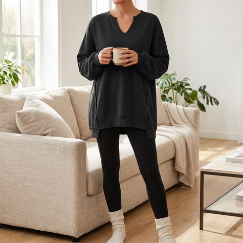 Oversized V-neck sweatshirt tunic worn with leggings, front view