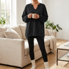 Oversized V-neck sweatshirt tunic worn with leggings, front view