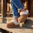 Womens suede platform clogs stepping down a porch step