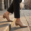 Womens block heel court shoes mid step on a city pavement