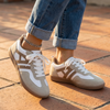 Retro colorblock low top sneakers for women on warm terracotta paving