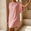 Mock neck midi dress for women with batwing split sleeves in a warm interior