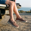 Mesh slip on sneakers for women with a buckle strap