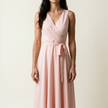 Wrap maxi dress for women on a pale studio backdrop showing the wrap front and waist tie