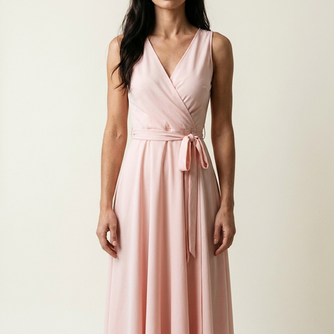 Wrap maxi dress for women on a pale studio backdrop showing the wrap front and waist tie