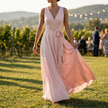Wrap maxi dress for women on a lawn at a vineyard wedding in golden hour