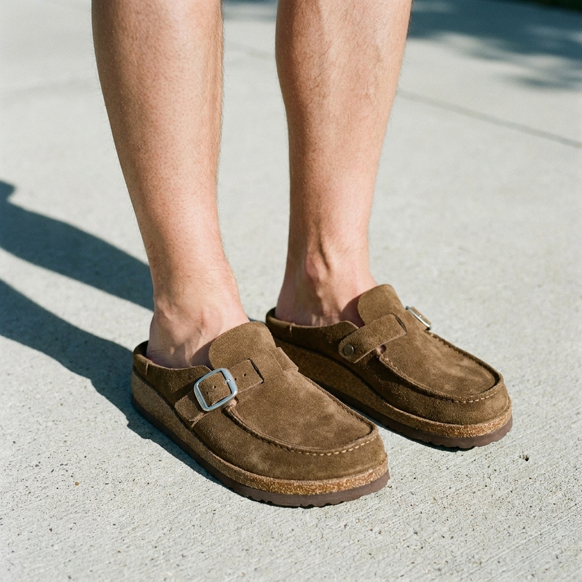 Suede clogs for women, standing on clean sunlit concrete seen from above