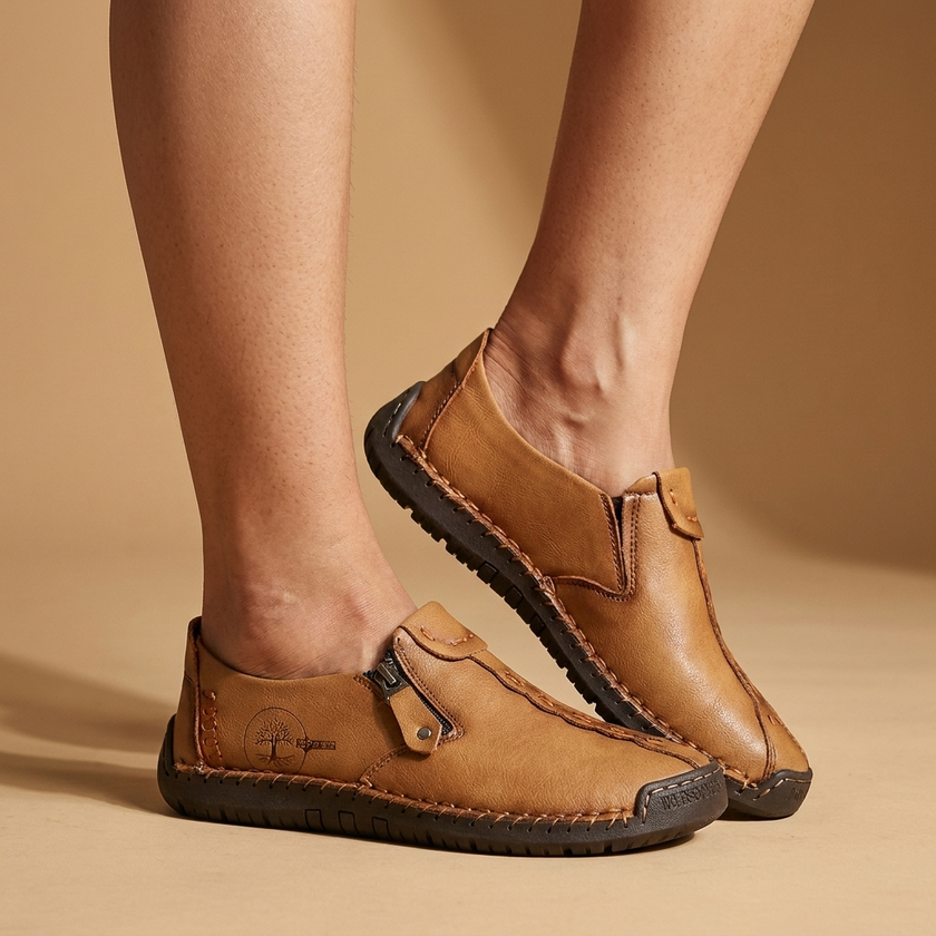 Elegant dress shoes for women on a warm studio floor in soft directional light
