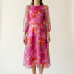 Floral formal midi dress for women on a pale studio backdrop, print shown full length