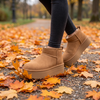 Fur lined wide width platform booties walking on fall leaves