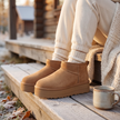 Wide width platform ankle boots with fur lining worn on a cabin porch in autumn