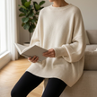 Jennifer oversized drop shoulder knit sweater on a linen sofa