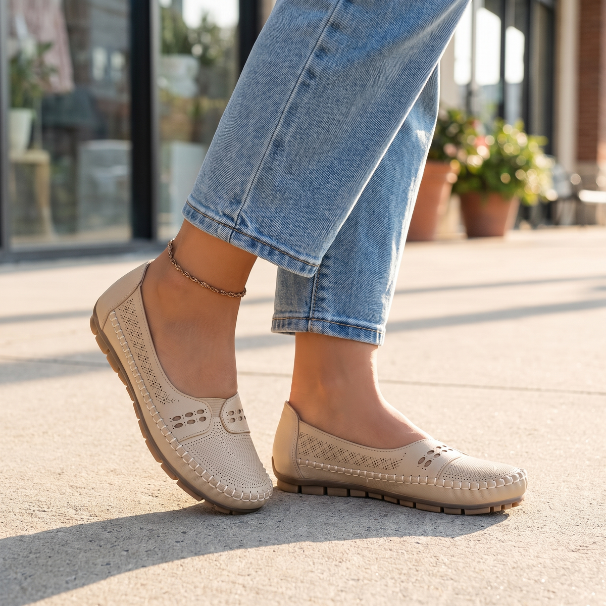 Beige arch support slip-on shoes for women worn with cropped jeans