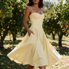 Womens corset midi dress with pockets in yellow, wedding guest A-line dress worn at a citrus orchard garden wedding