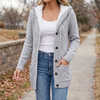 Women's hooded button front cardigan in light grey, worn open over a white tank