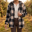 Women's checked hooded fleece jacket in black and beige, worn open